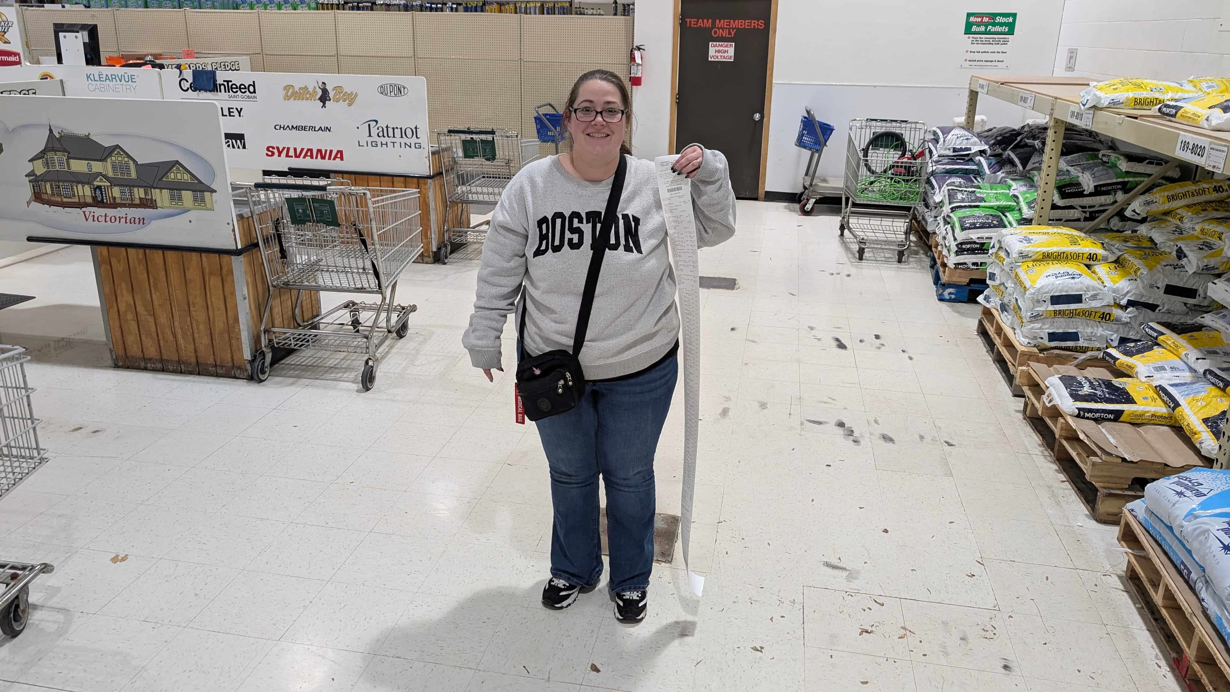 Lauren, documenting the supply run with a receipt taller than she is